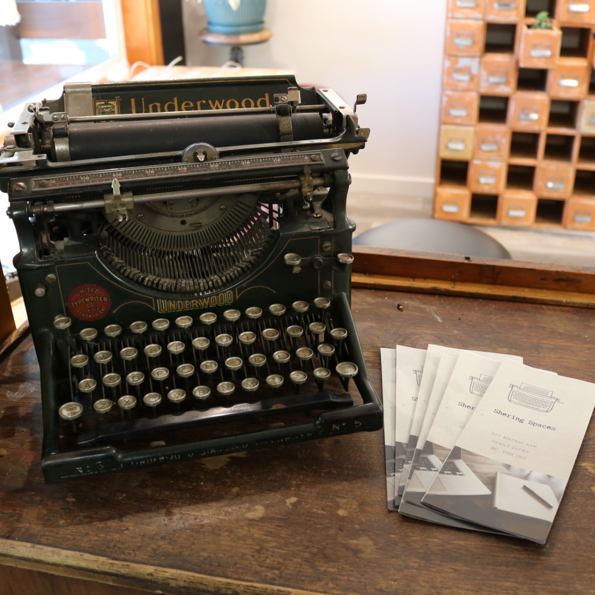 shering spaces brochure with vintage typewriter