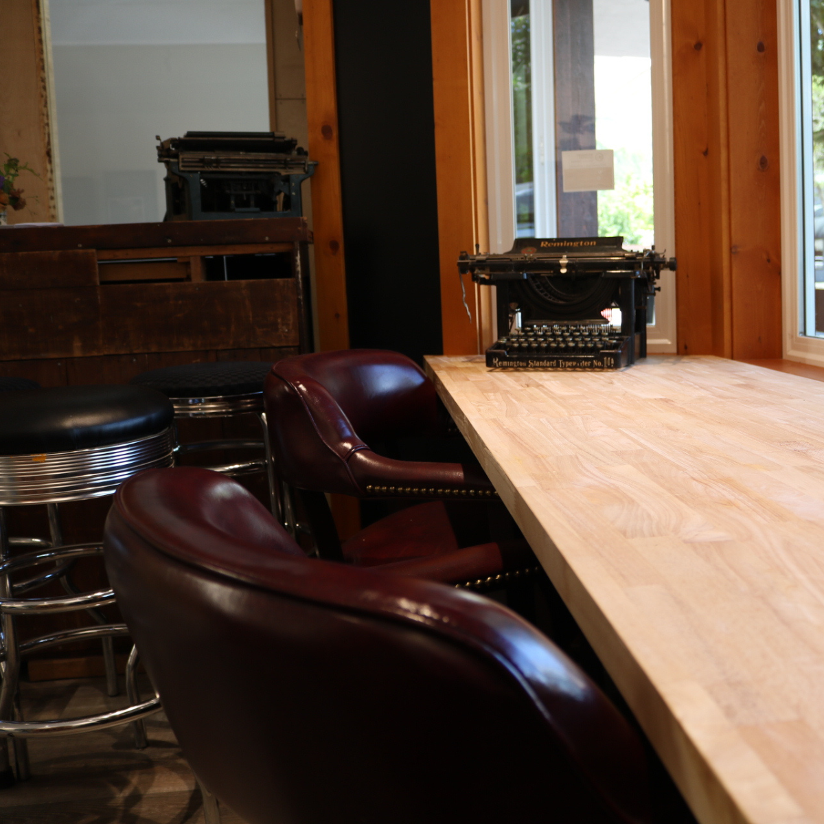 leather brown chairs with vintage typewriter