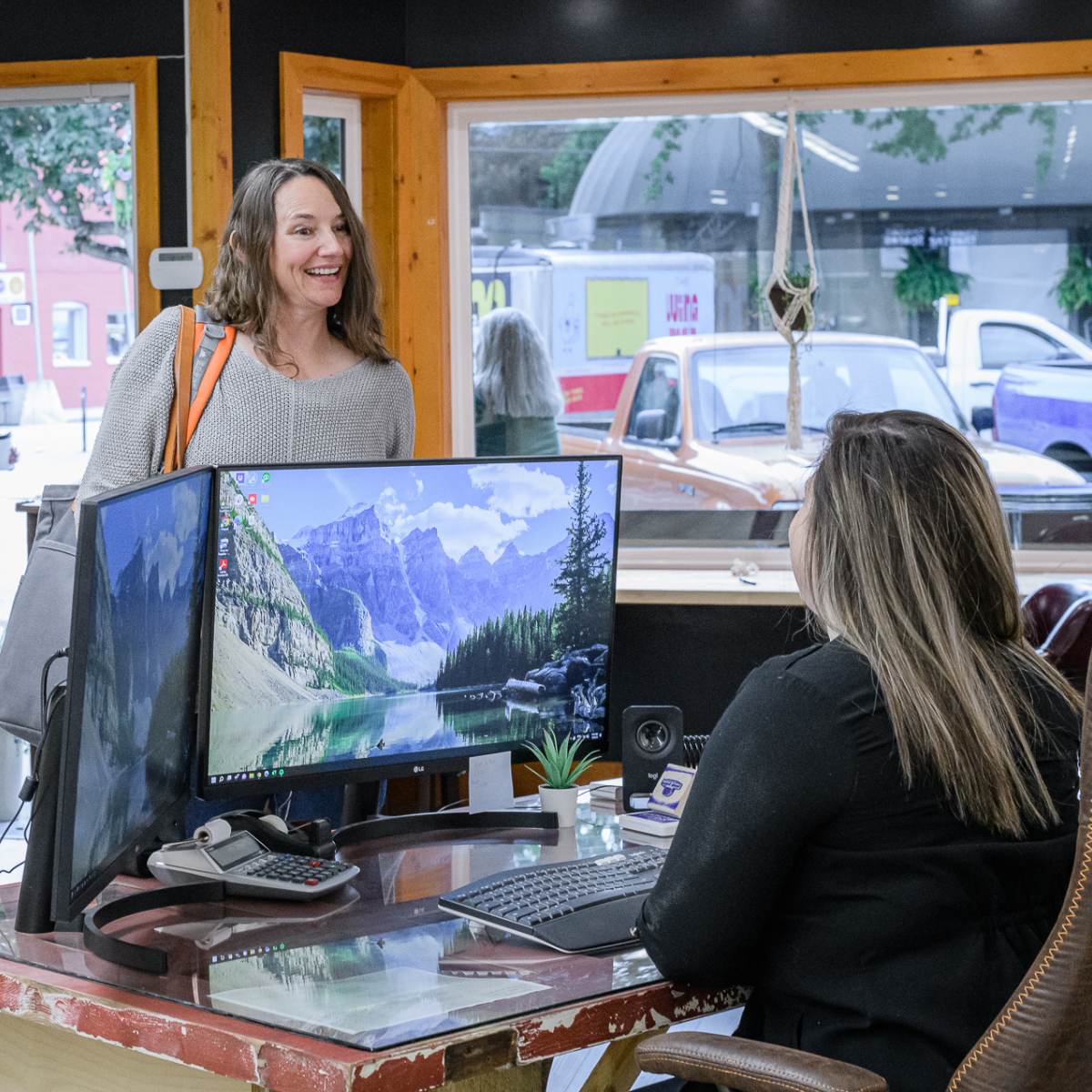 two happy women reception area