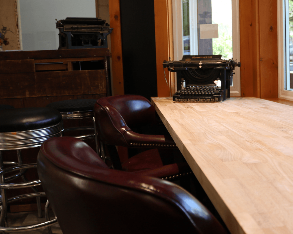 leather brown chairs with vintage typewriter
